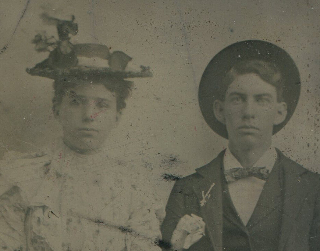 Tintype Photograph Couple Seated with Hands Folded, Hats Balanced on Heads