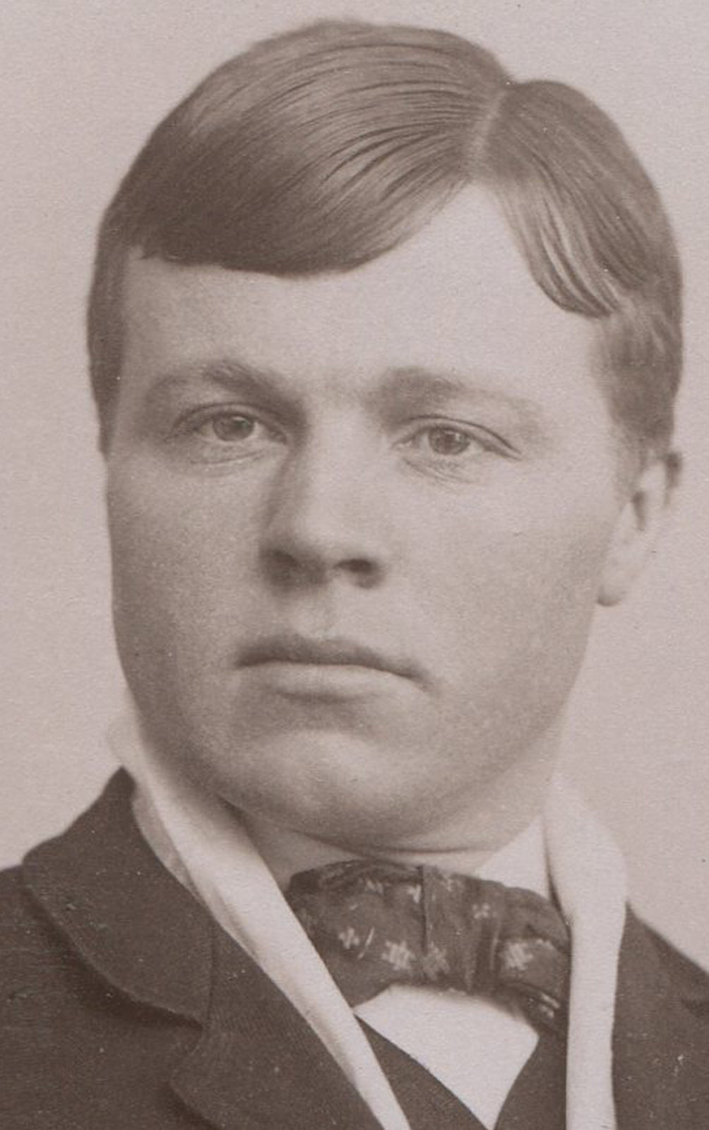 DAPPER YOUNG MAN, POMPOUS FACIAL EXPRESSION. CABINET CARD. AKRON, OHIO.