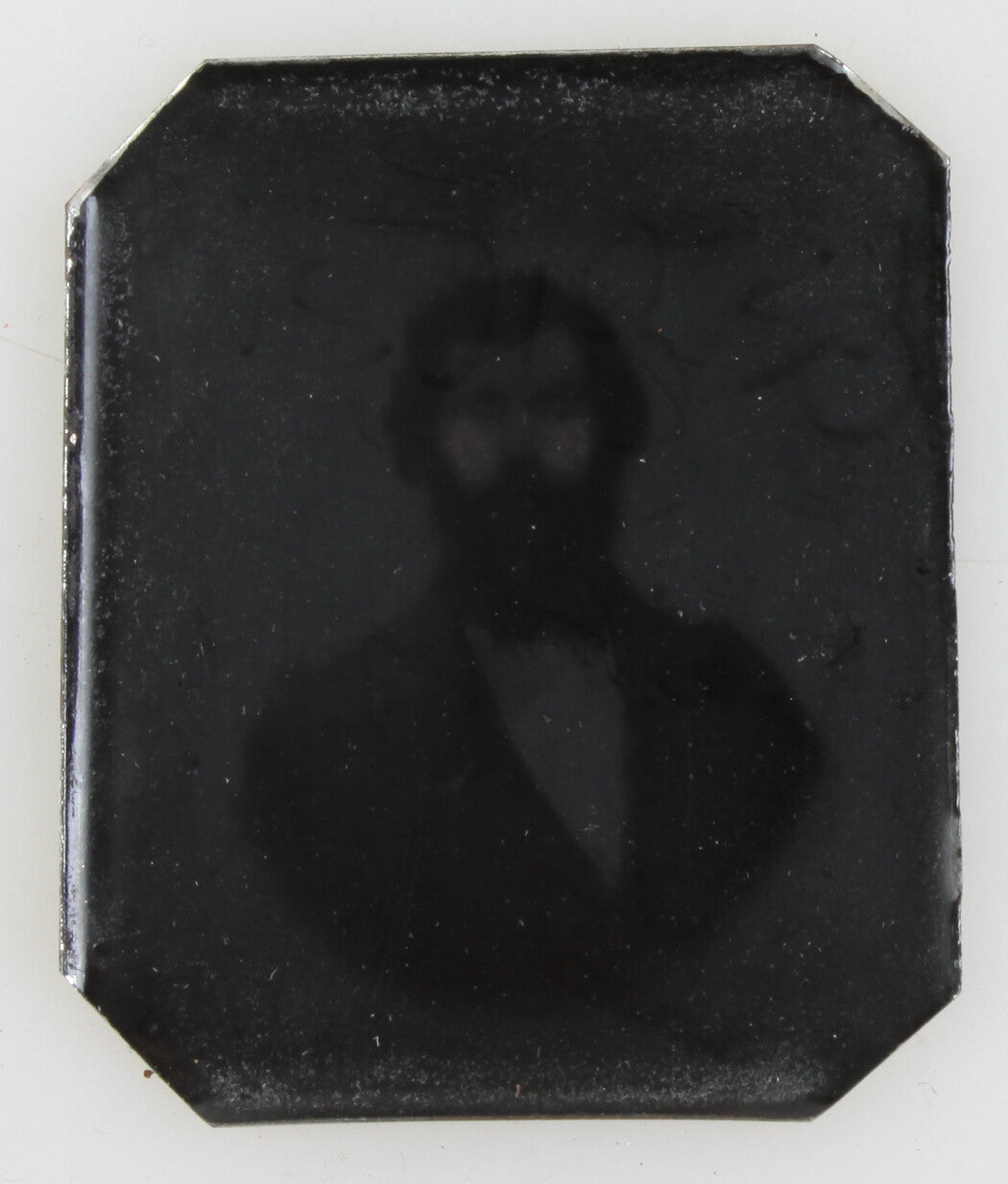 GHOST LIKE MALE IMAGE ON METAL.