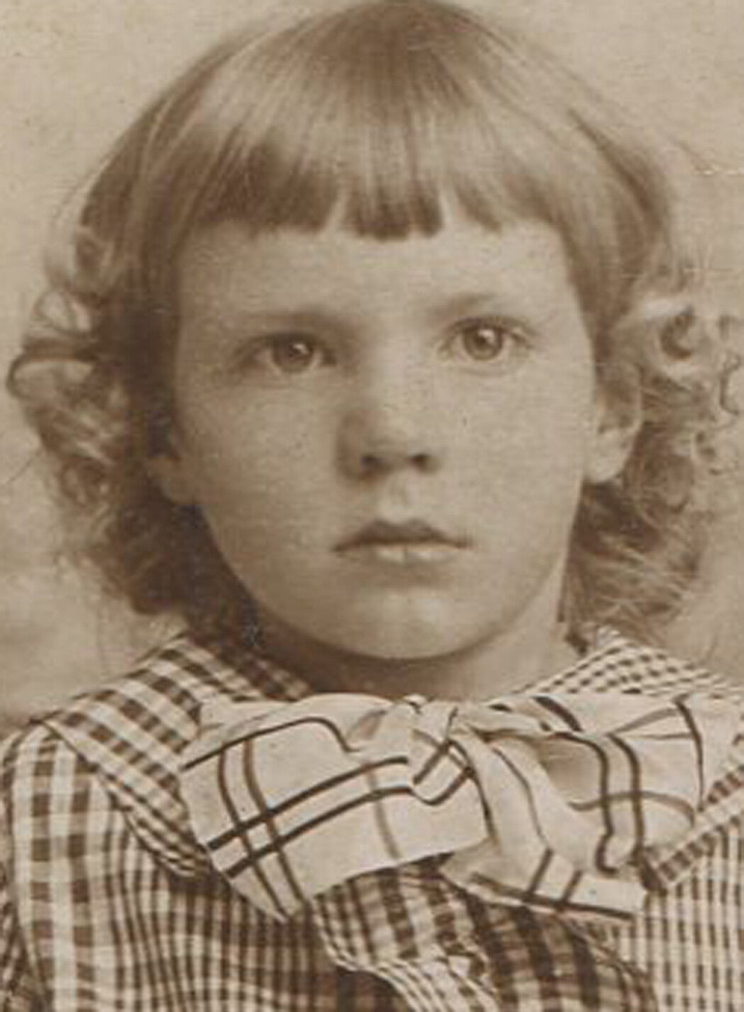 YOUNG GIRL IN PLAID DRESS REALIZING SHE HAS NO STYLE. WARE, MASS.