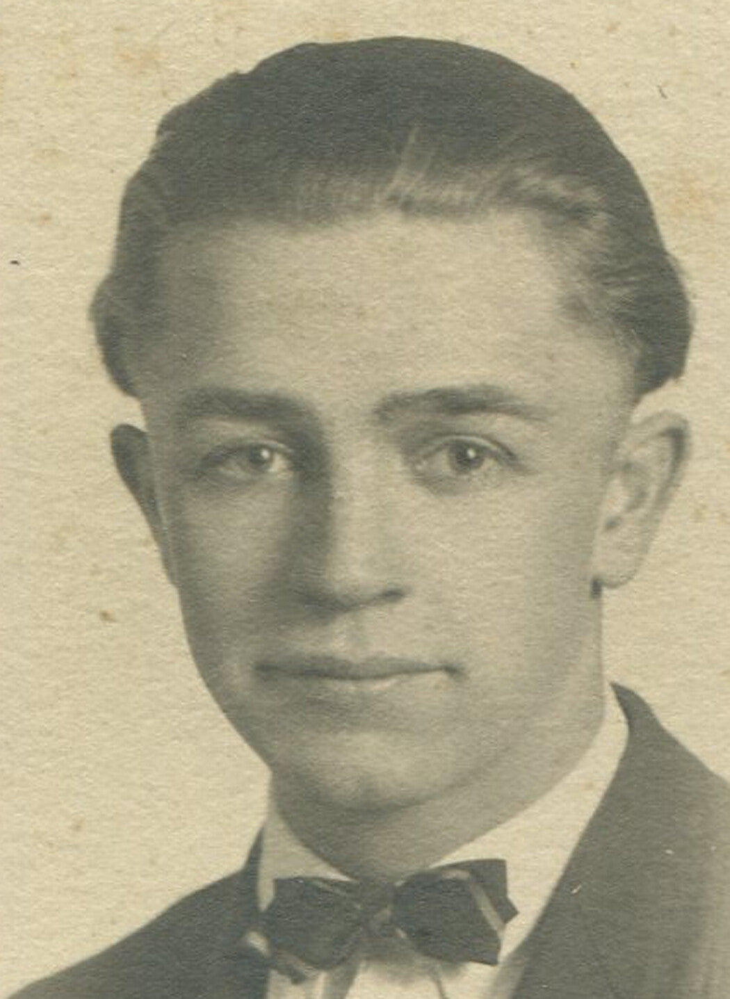 YOUNG MAN, BOW TIE, CLEFT CHIN. B W PHOTO IN FOLDER.