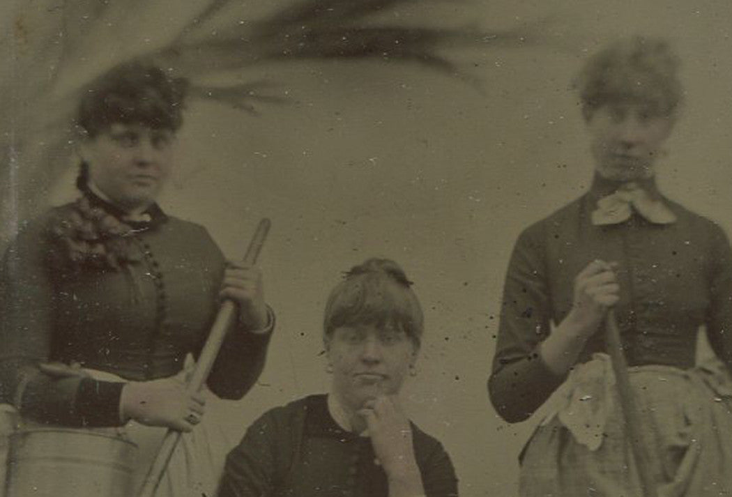 THREE WOMEN POSED WITH FARM TOOLS. TINTYPE.