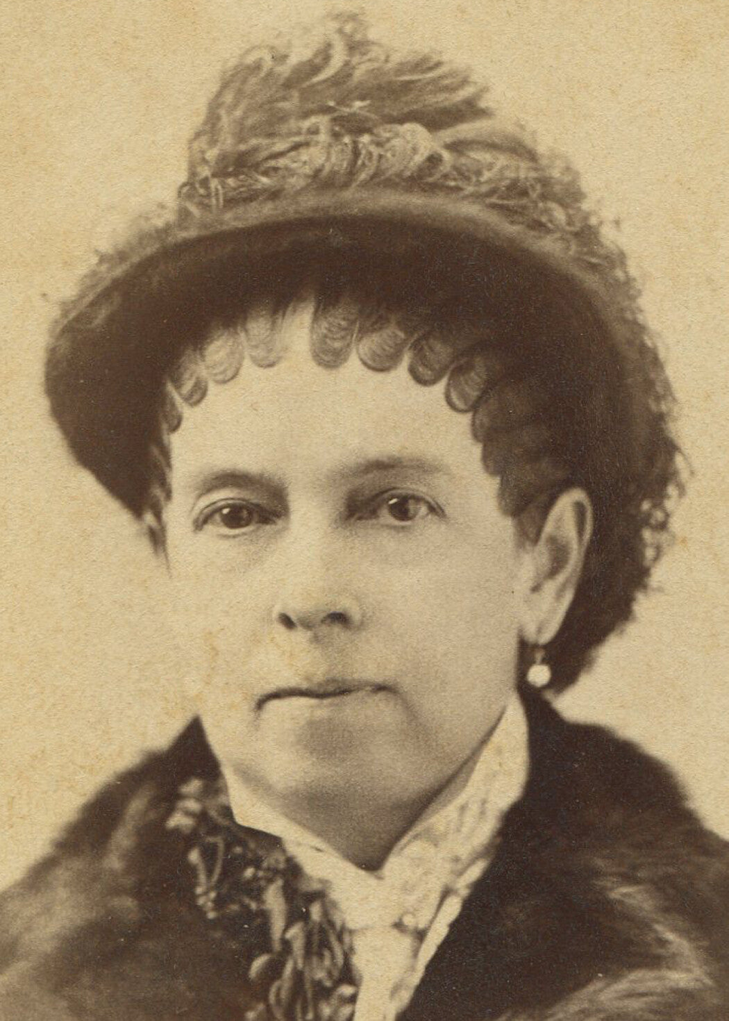WOMAN IN VERY SEVERE PIN CURLS, FEATHER HAT. CABINET CARD, NEWARK, N.J.
