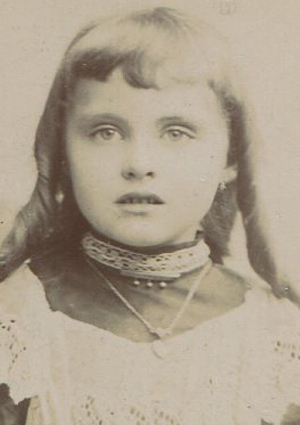 YOUNG GIRL IN LONG RINGLET CURLS, POSED AT GATE. CABINET CARD.