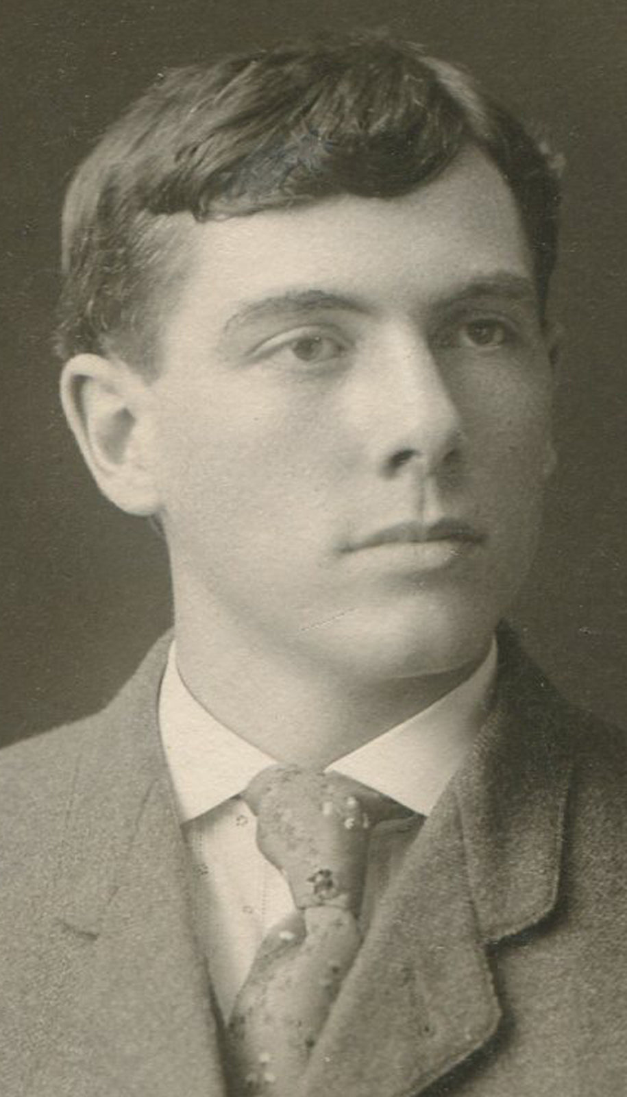 Vintage man in suit with slanted breast pocket photo, circa 1900, silver print