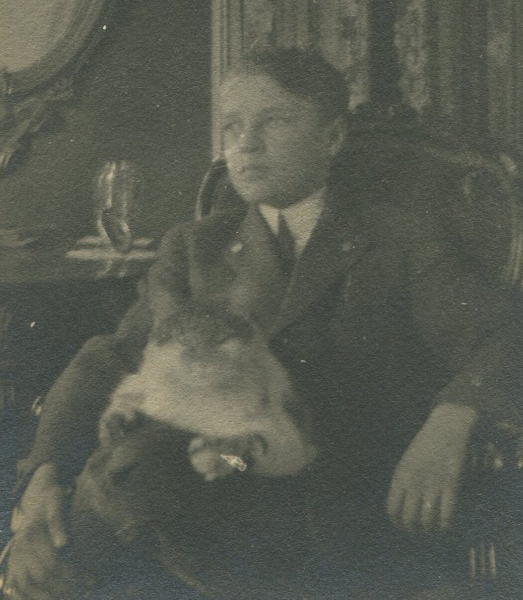 BOY SEATED POSE, CAT ON LAP. SILVER PRINT, CIRCA 1900.
