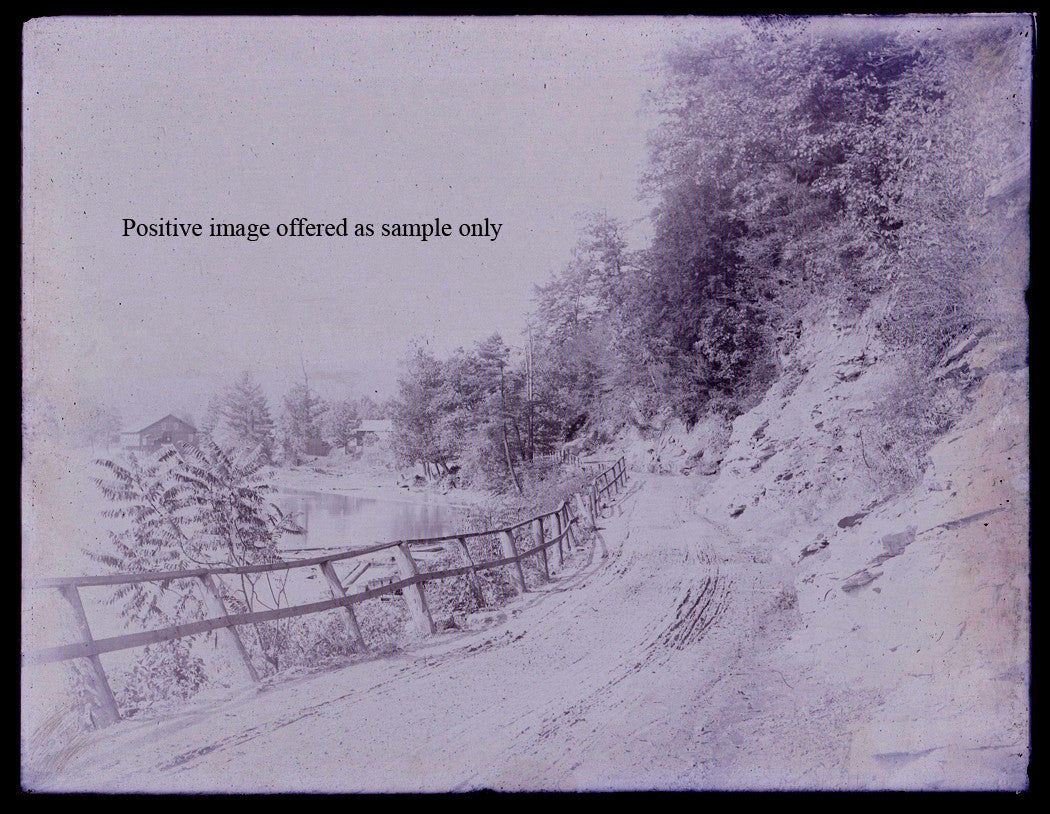 COUNTRY LANE WITH FENCE NEXT TO POND. GLASS PLATE NEGATIVE, 6.5 X 8.5 INCHES.