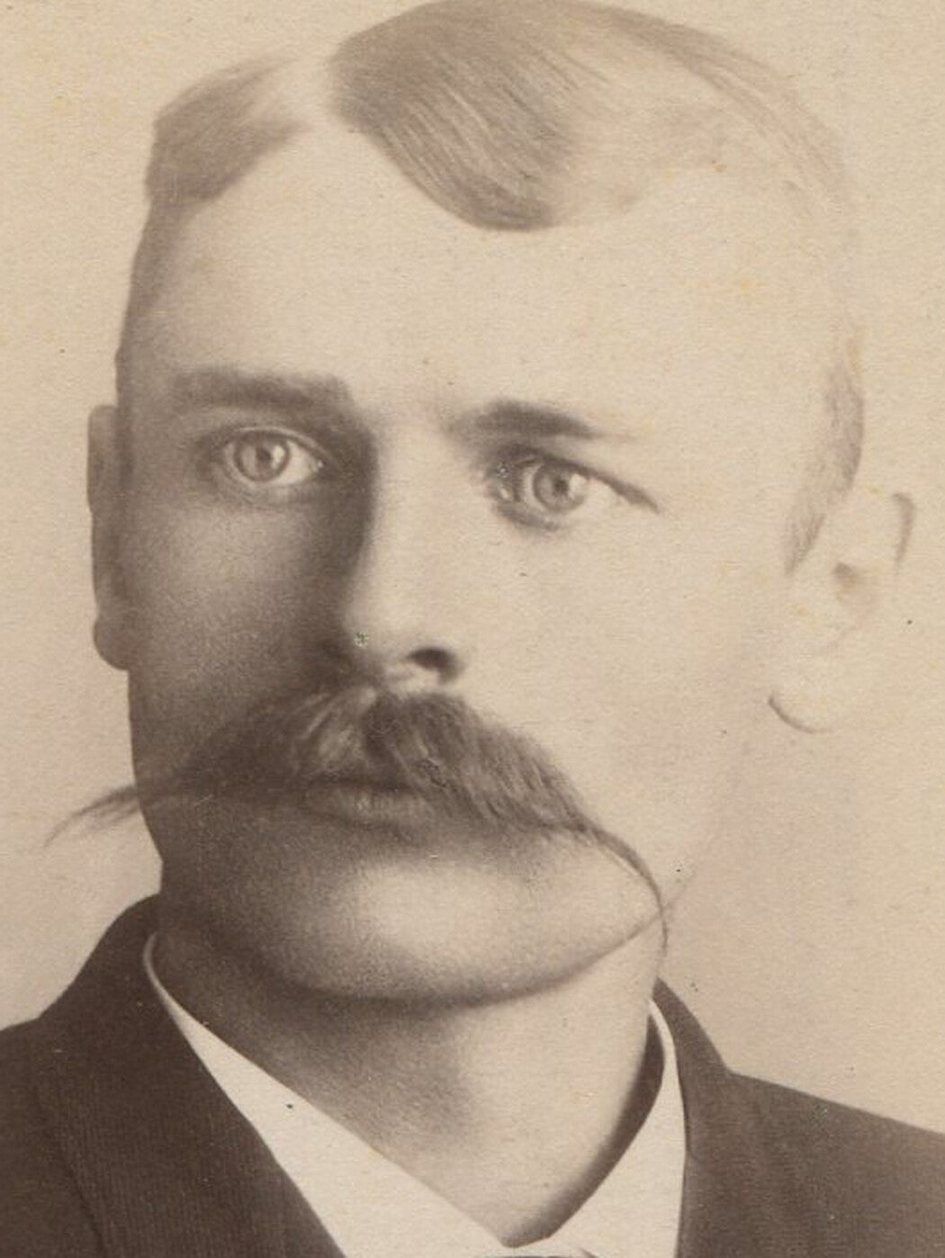 PRETTY EYED MAN WITH WAXED MUSTACHE. CABINET CARD. BENZONIA, MICHIGAN.