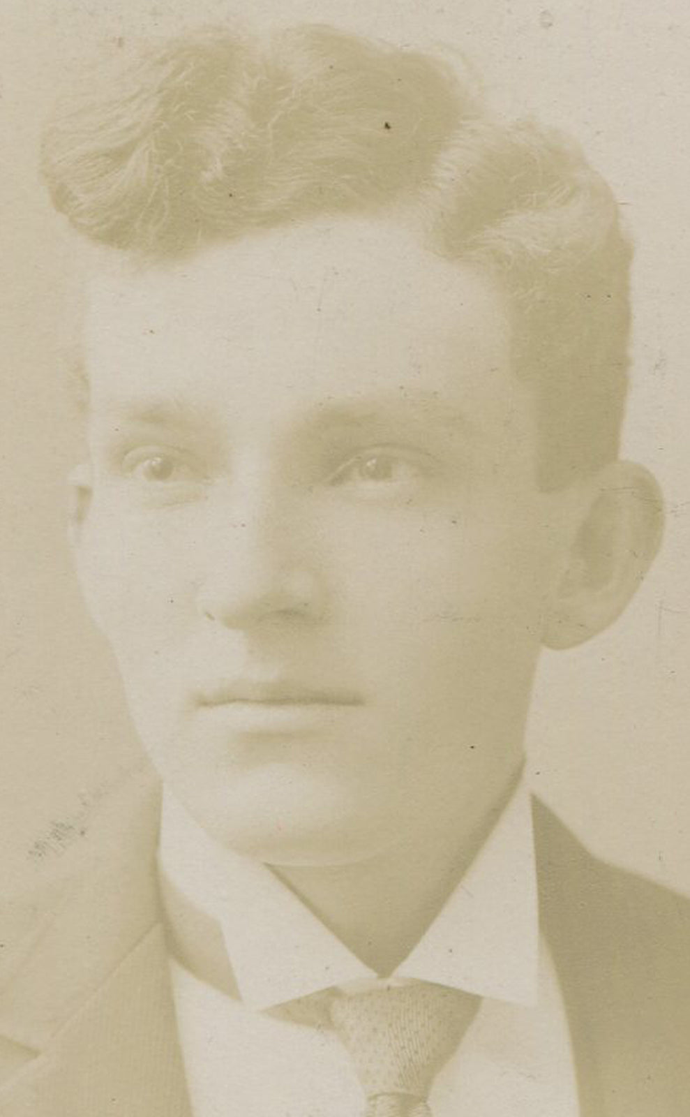 YOUNG MAN GOING FOR A POMPADOUR HAIRSTYLE. CABINET CARD. WELLSVILLE, OHIO.