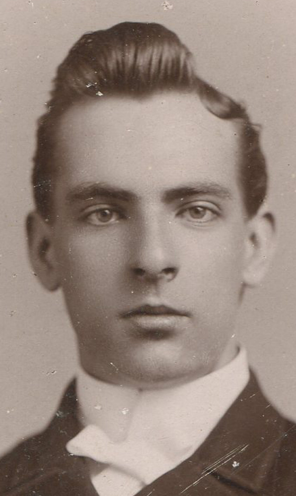 YOUNG MAN ROCKING A POMPADOUR HAIRSTYLE. CABINET CARD.