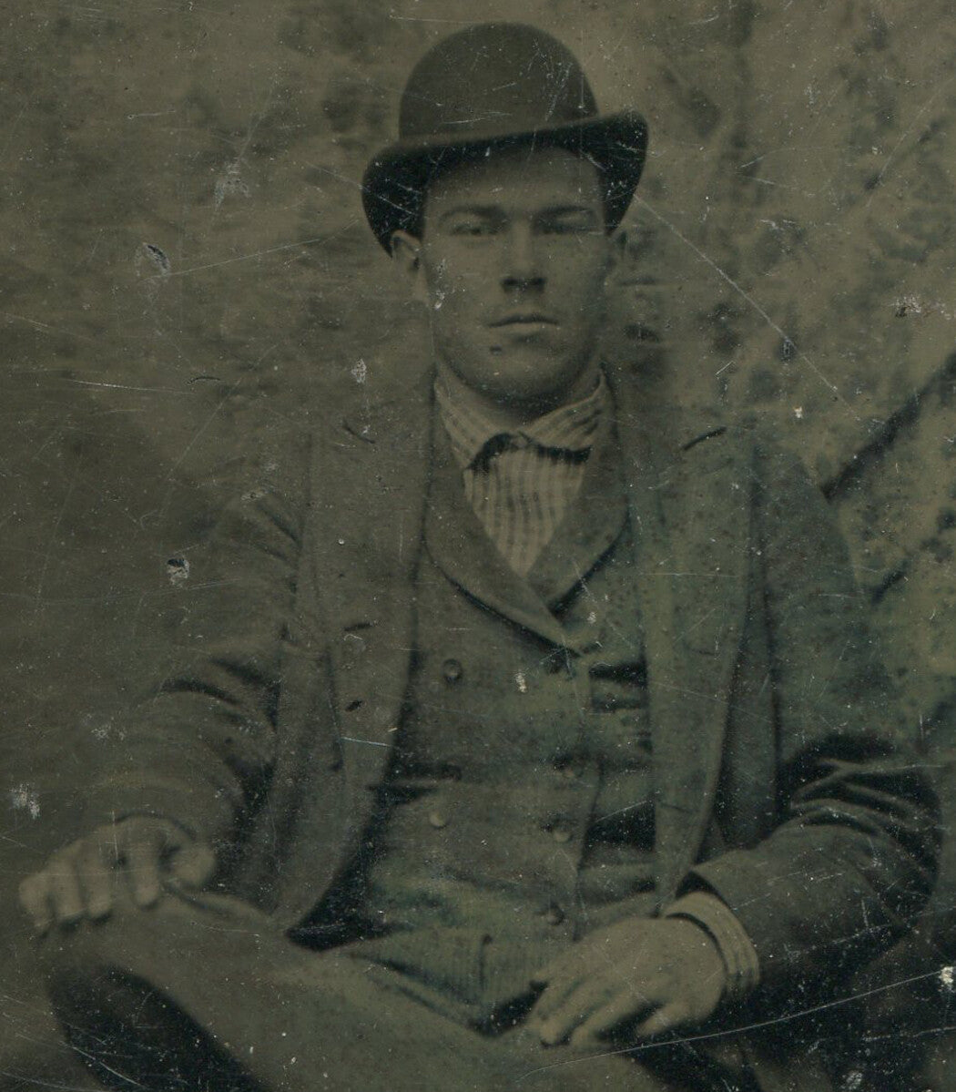 Vintage Tintype Portrait of Man in Hat, Cross-Legged Pose, Mean Expression