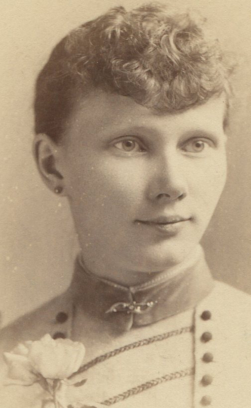 WOMAN W/CURLY POMPADOUR, AND CORSAGE. CABINET CARD. N.Y.