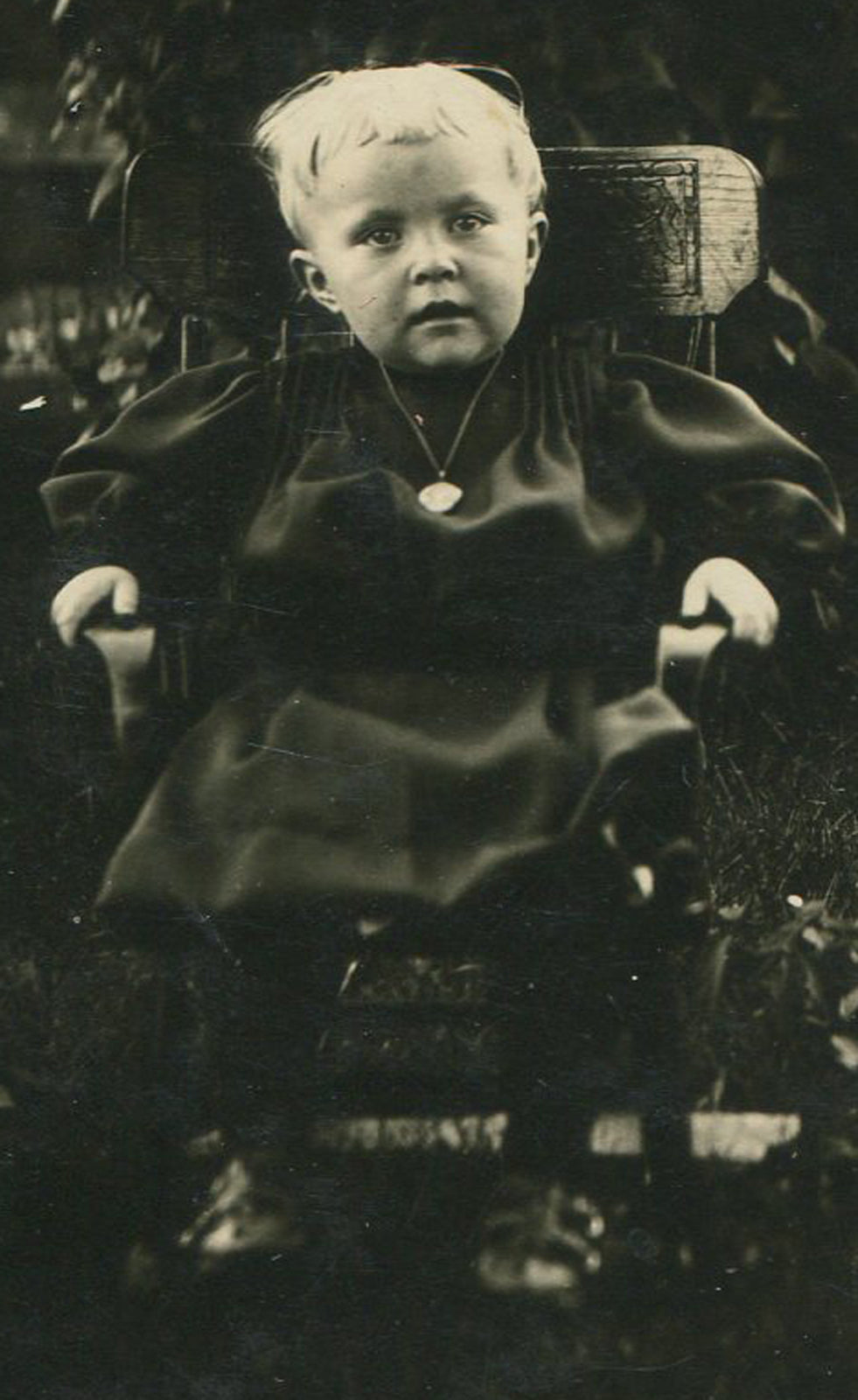 TODDLER SEATED IN GARDEN. PHOTO POSTCARD. 2 SET.