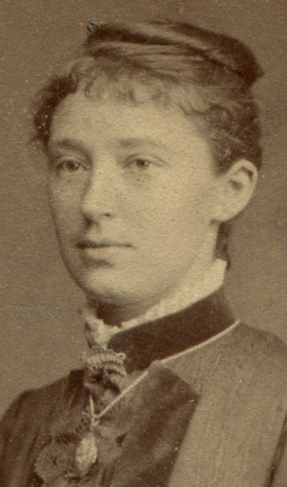 WOMAN POSED LEANING ON CHAIR, HOLDING FLOWER. CDV.