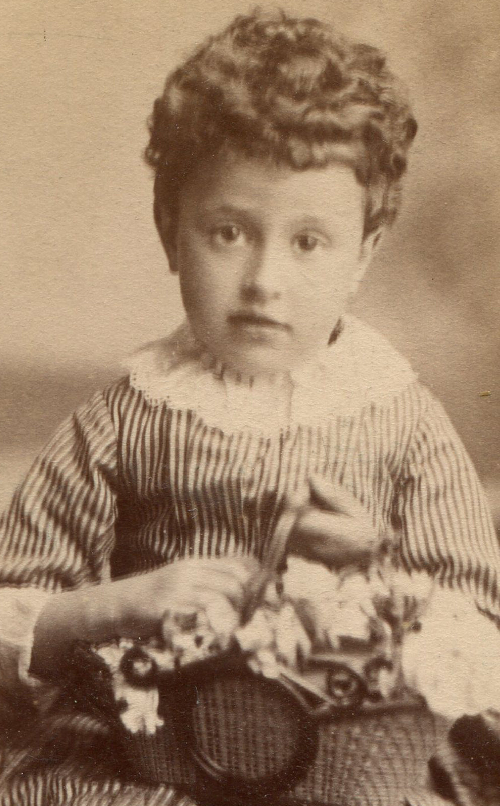 CURLY HAIRED LITTLE GIRL HOLDING BASKET OF FLOWERS. CDV. N.Y.