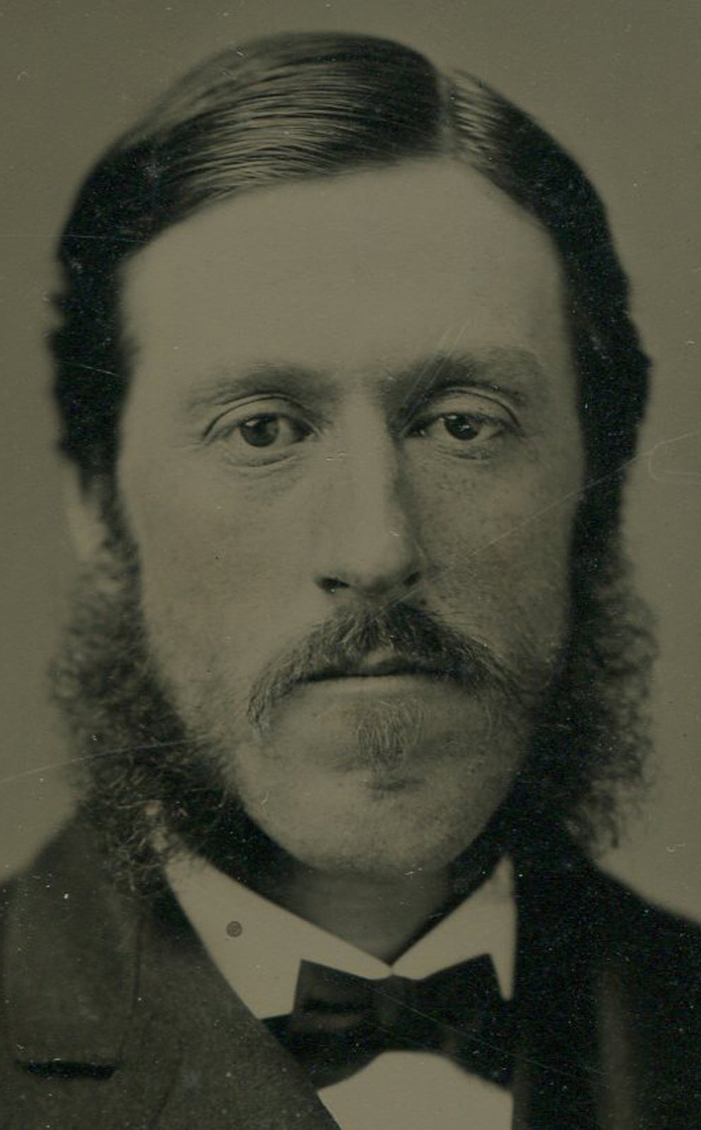 LONG FACED MAN, PENSIVE EXPRESSION, MUTTON CHOPS. TINTED FULL PLATE TINTYPE.