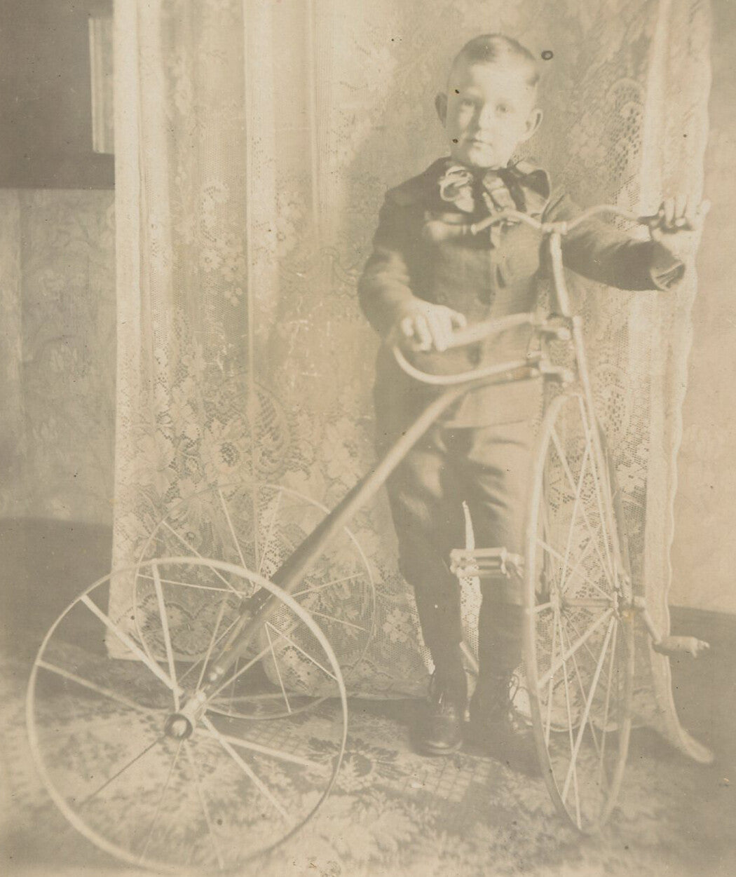 YOUNG BOY POSED WITH BIG NEW TRICYCLE. 1880-1900.