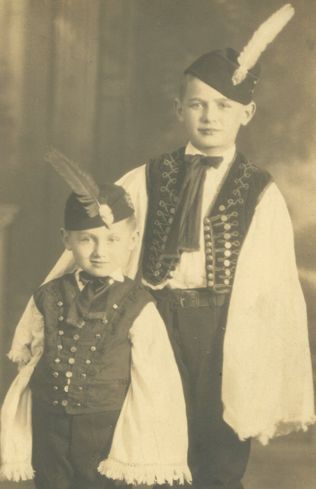 BOYS IN ETHNIC COSTUMES. TONED SILVER PRINT, 6 X 4 INCHES.