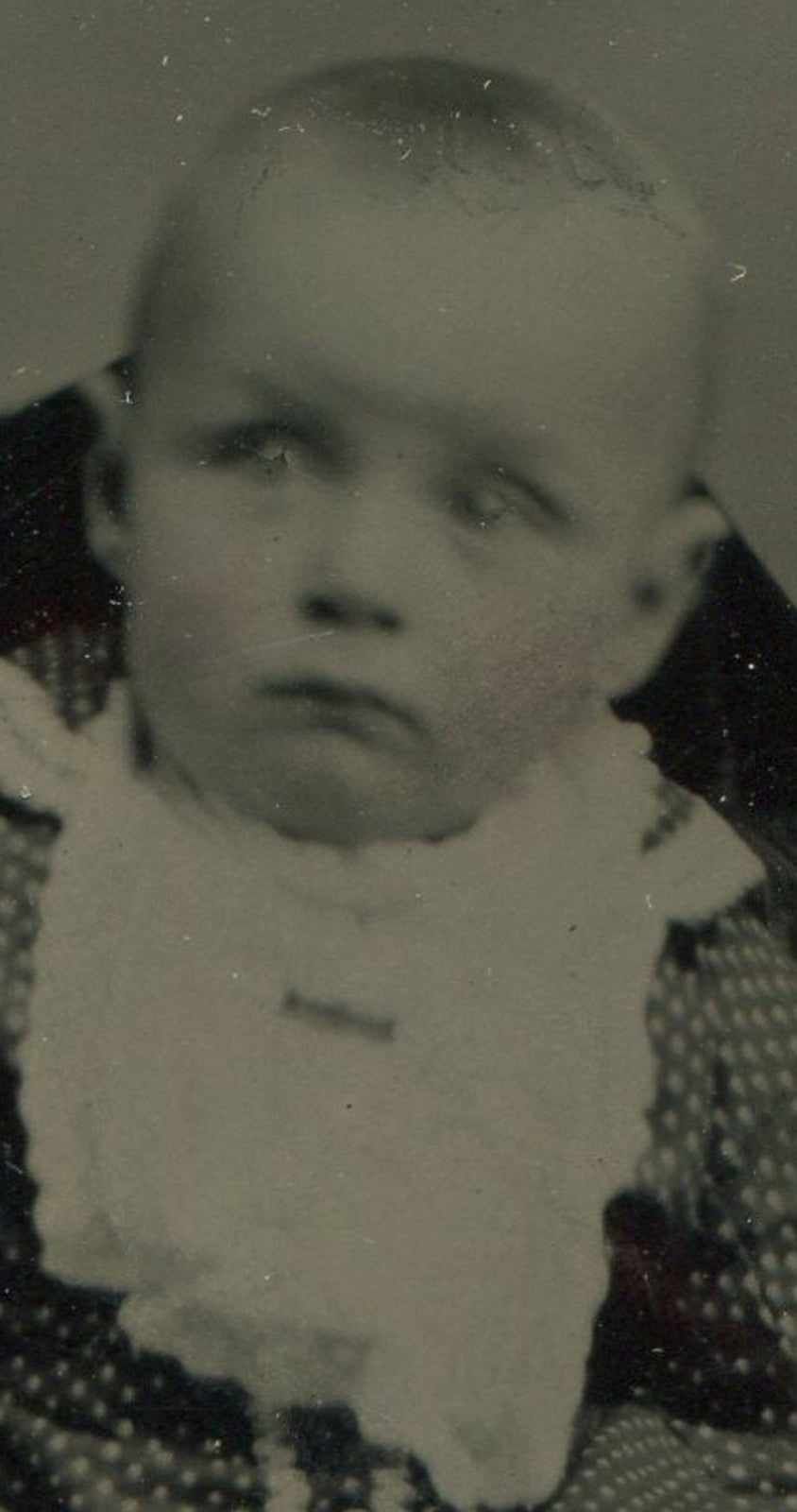 BABY IN BIB. TINTYPE IN PERIOD PAPER MAT.