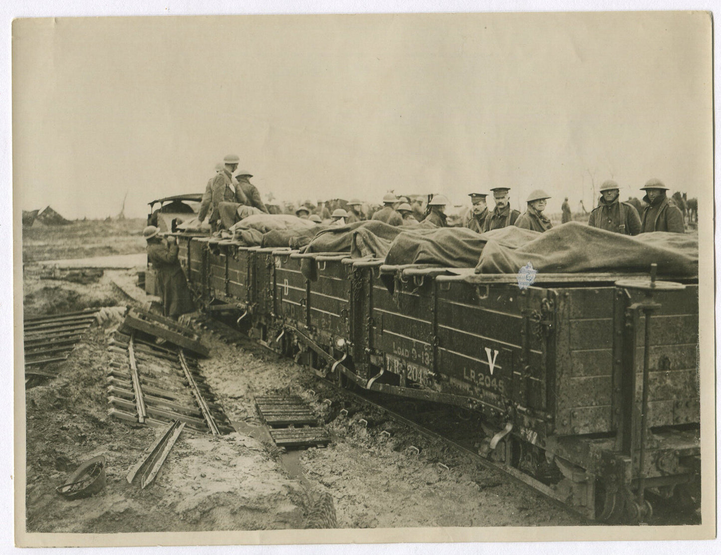 BRITISH WOUNDED CARRIED TO RAIL TRANSPORT. WWI. (8X10 REPRINT)