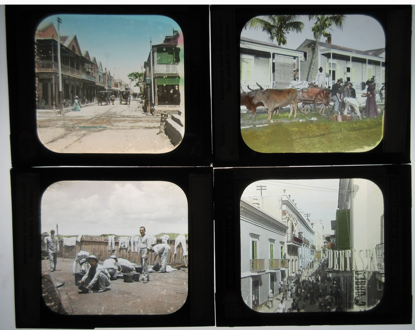 WORKER'S CAMP/PRISON AND OTHER SCENES. 4 SET, TINTED PHOTO ON GLASS.