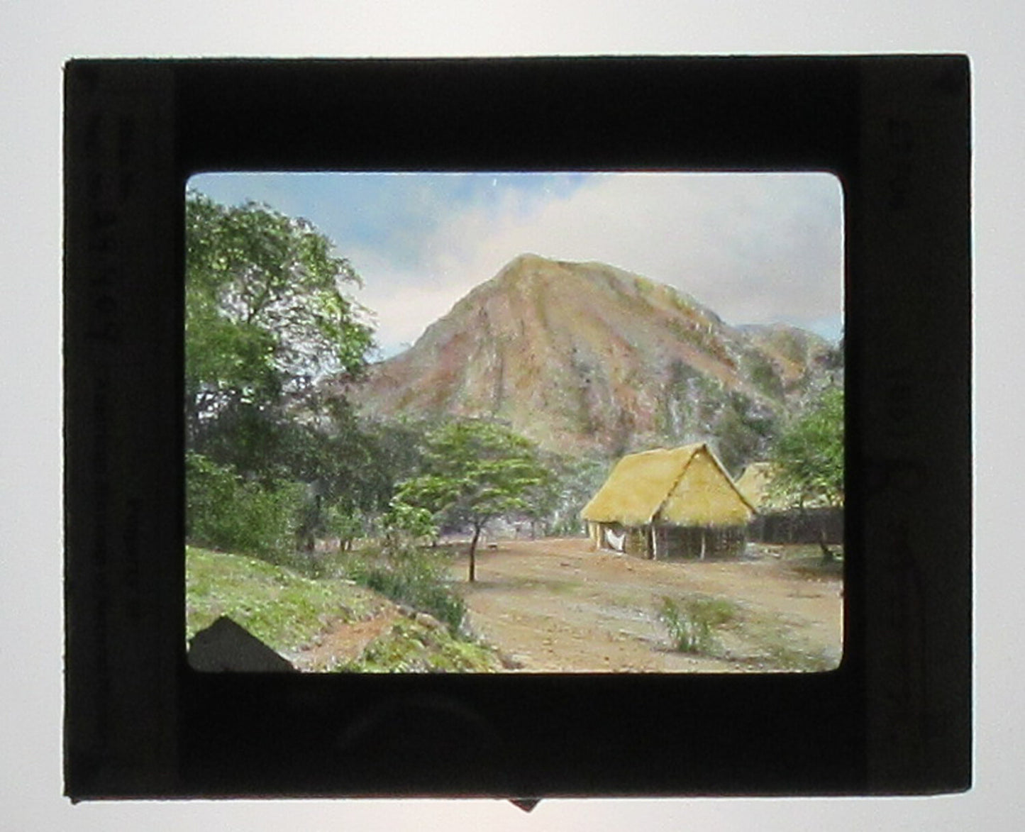 TRADITIONAL BAMBOO STRUCTURES, COLOMBIA. HAND COLORED PHOTO ON GLASS.