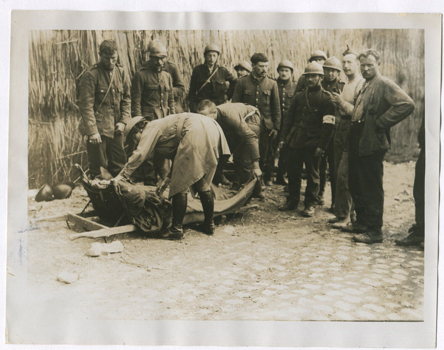 BRITISH WOMAN MEDIC TENDING WOUNDED IN BATTLE. WWI. (8X10 REPRINT)