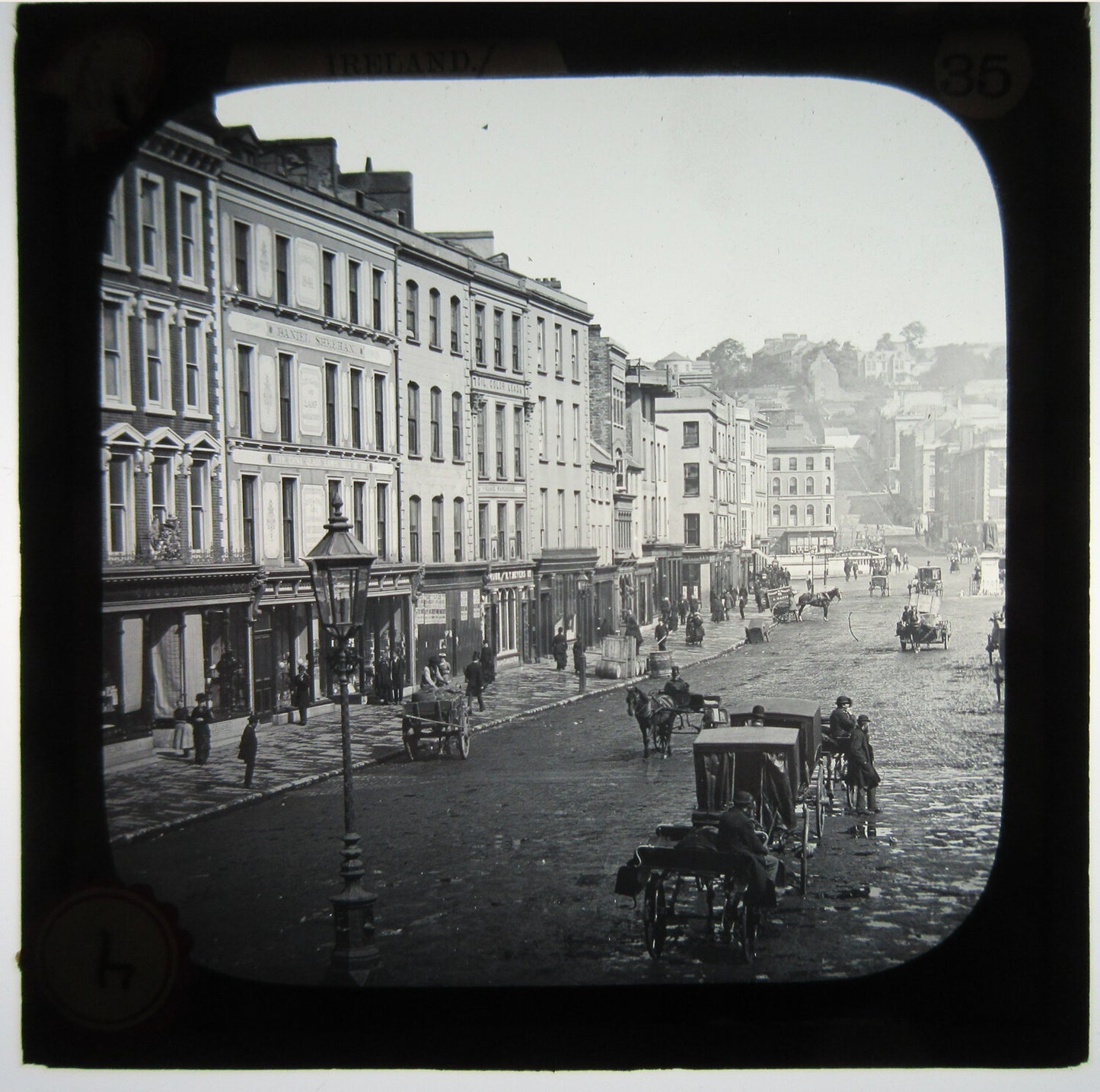 BUSY STREET SCENE WITH HORSE AND CARRIAGE. LANTERN SLIDE.