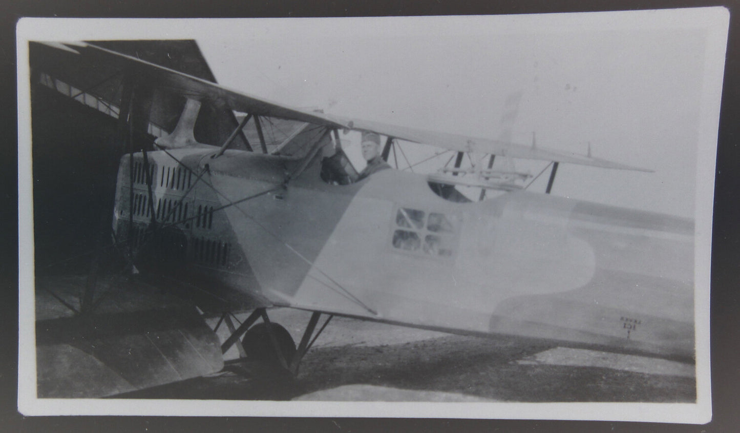 PILOT IN UNIFORM IN PLANE COCKPIT. 4X5 NEGATIVE.