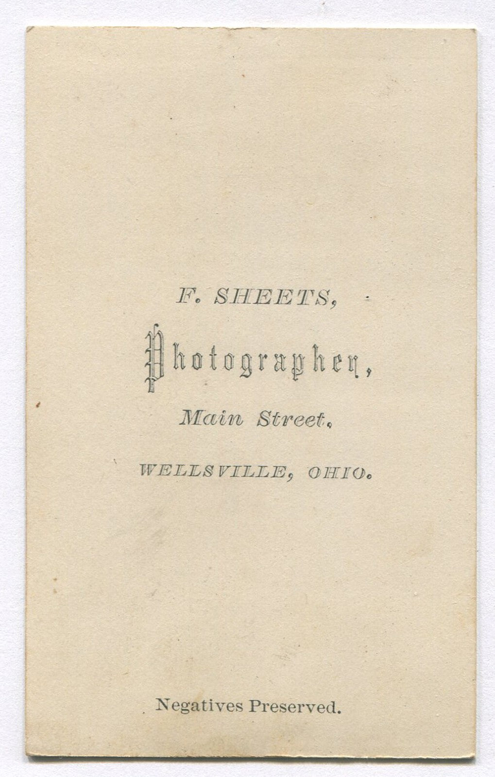 FULL LIPPED MAN IN BOW TIE. CDV. WELLSVILLE, OHIO.