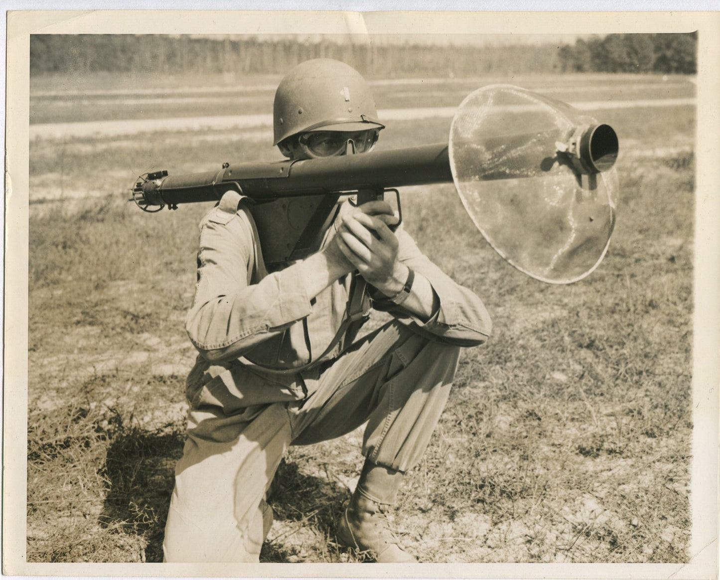 U.S. SOLDIER IN SAFETY GEAR AIMING SHOULDER HELD WEAPON. WWII. (8X10 REPRINT)