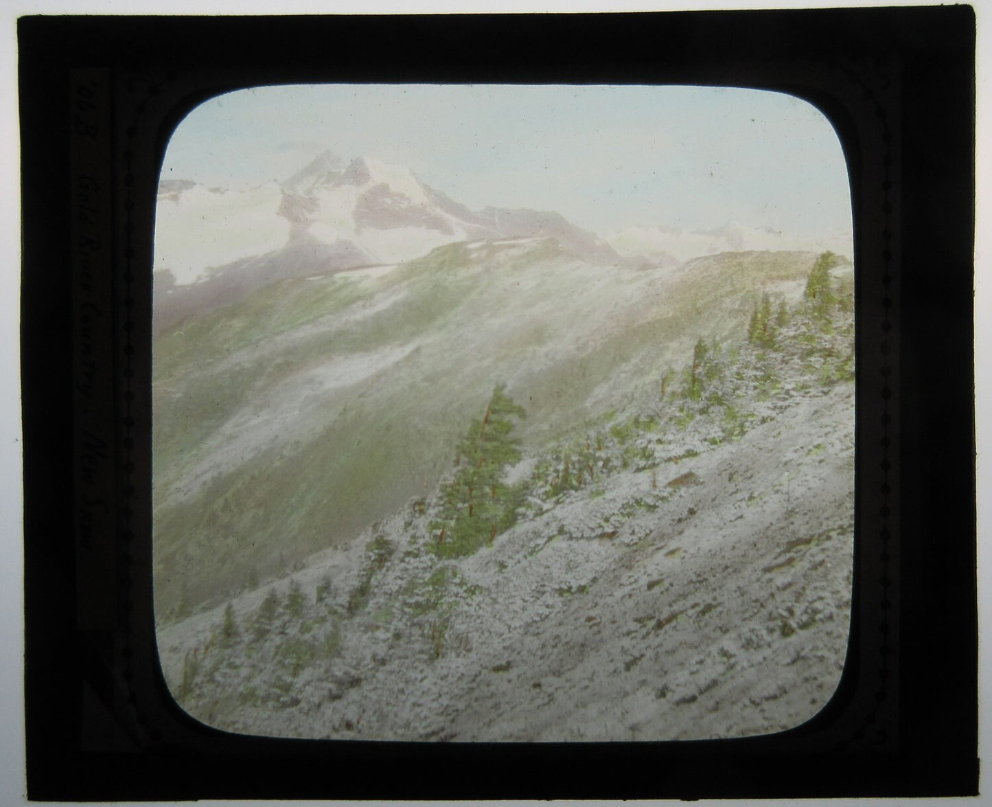 NEW SNOW, GOLD RIVER COUNTRY. HAND COLORED PHOTO ON GLASS.