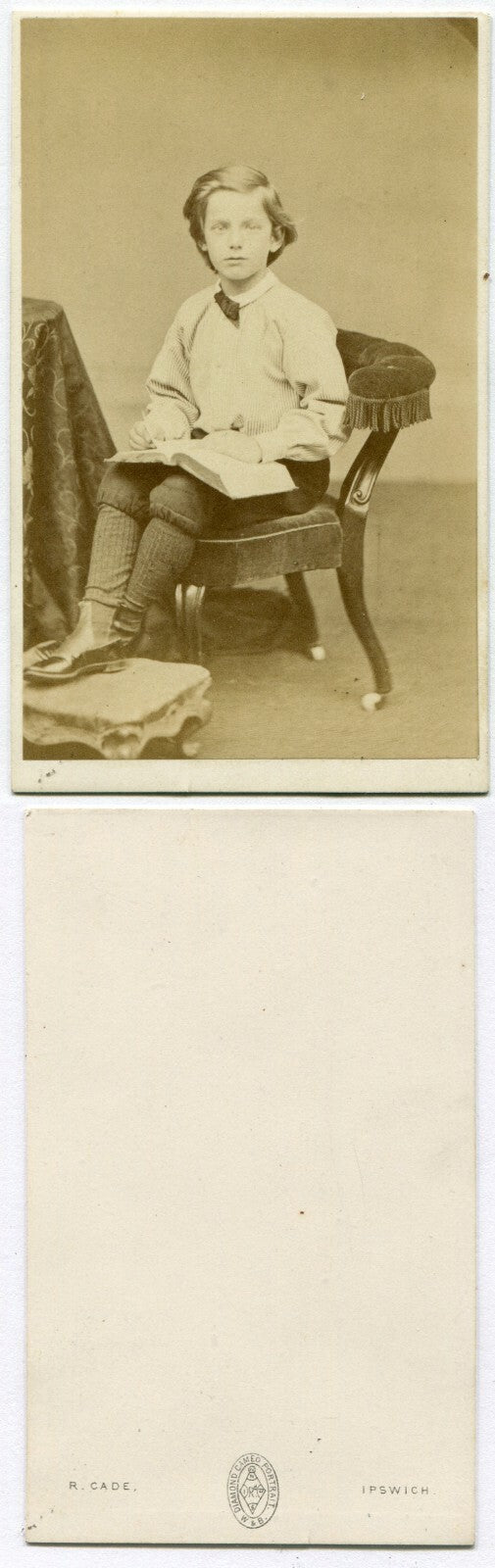 HANDSOME YOUNG HANDSOME RELAXED SEATED POSE WITH BOOK. CDV. IPSWICH, ENGLAND.