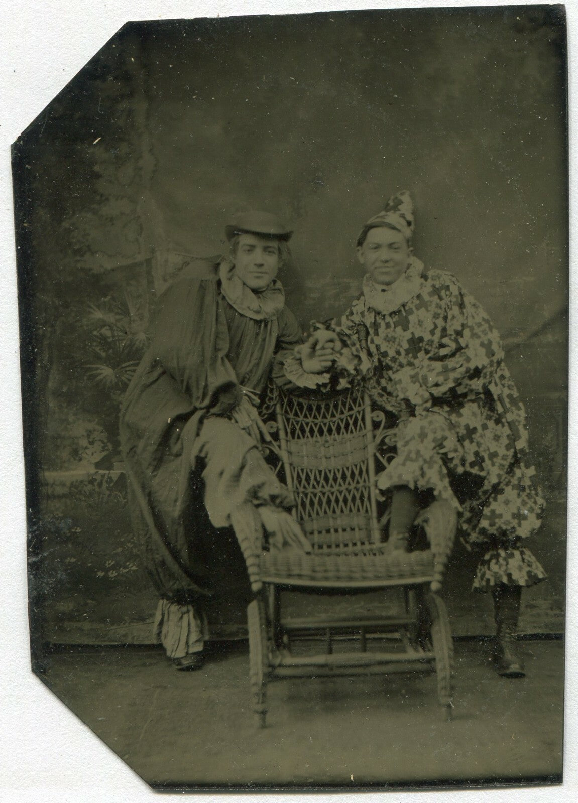 MALE CIRCUS PERFORMERS IN COSTUME. AFFECTIONATE POSE. TINTYPE.