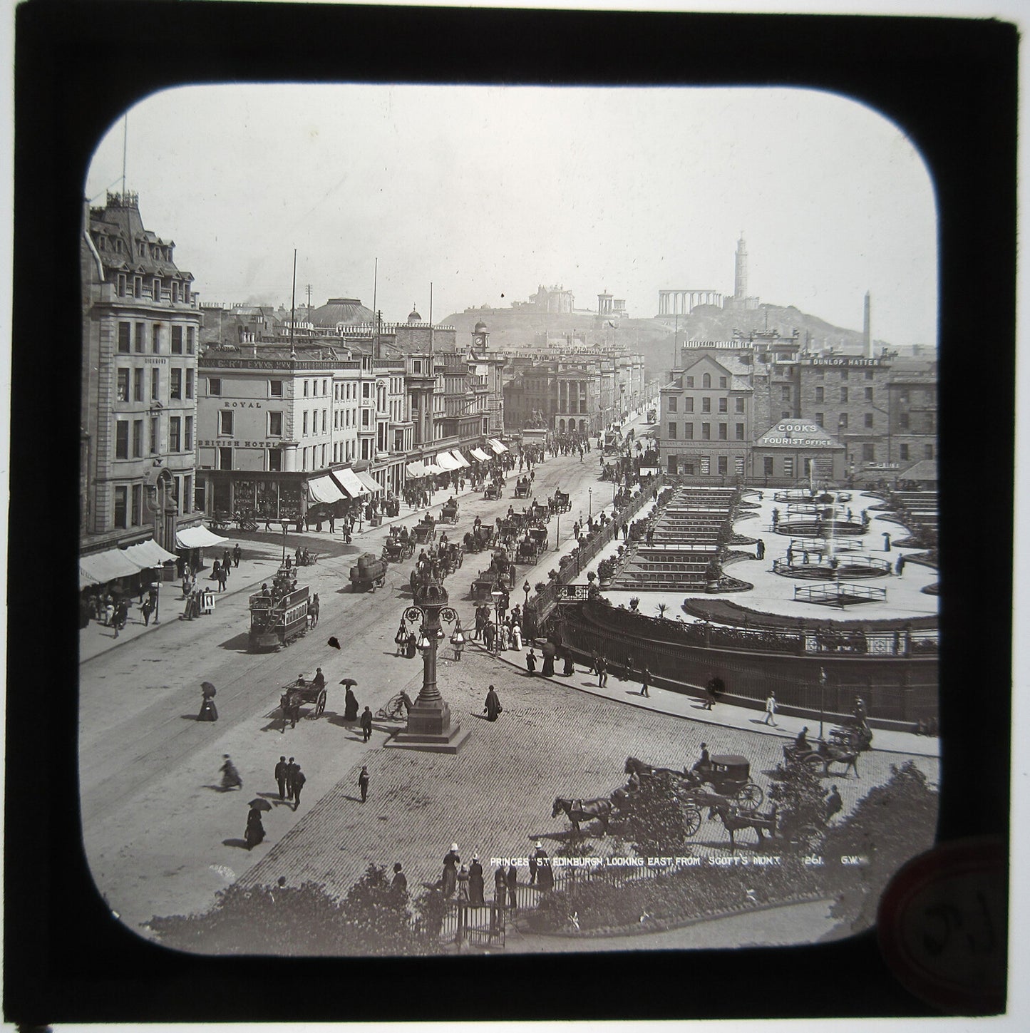 BUSY STREET OUTSIDE ROYAL BRITISH HOTEL. 1870-90. LANTERN SLIDE.
