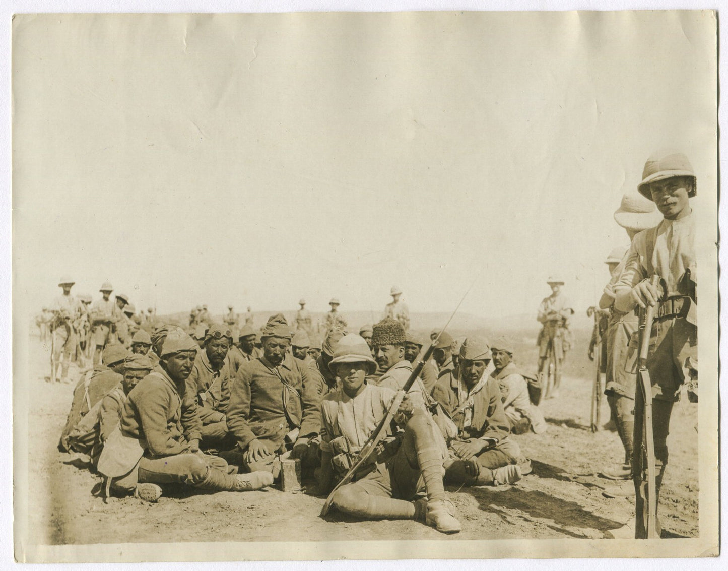 BRITISH TROOPS REST TURKISH PRISONERS ON MARCH TO BAGHDAD. (8x10 REPRINT)