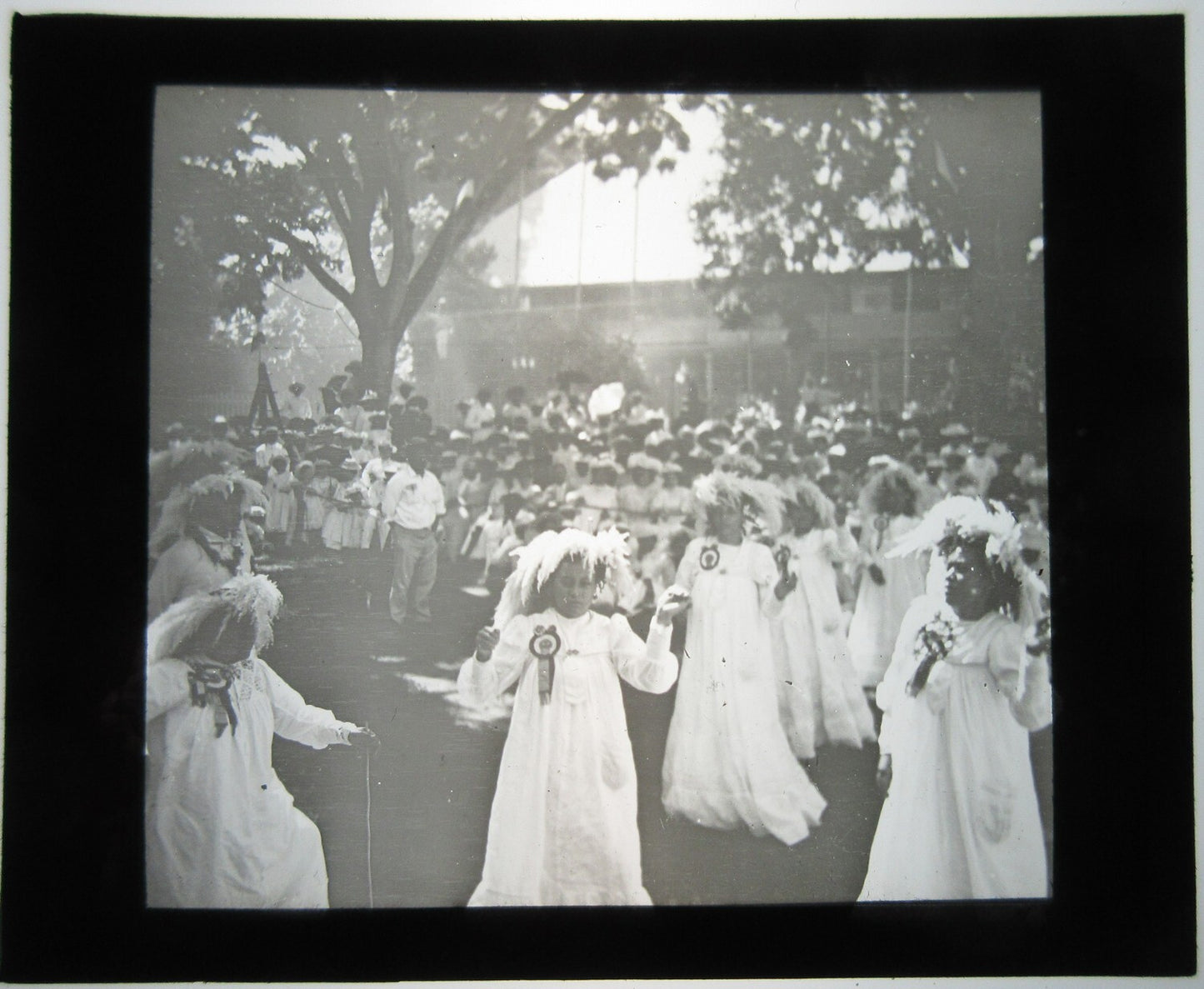 YOUNG WOMEN PARTICIPATE IN CULT CEREMONY. LANTERN SLIDE.