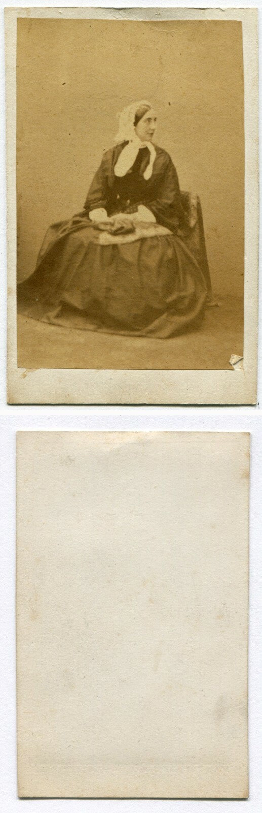 WOMAN IN BONNET, HOLDING ITEMS ON LAP. CDV.