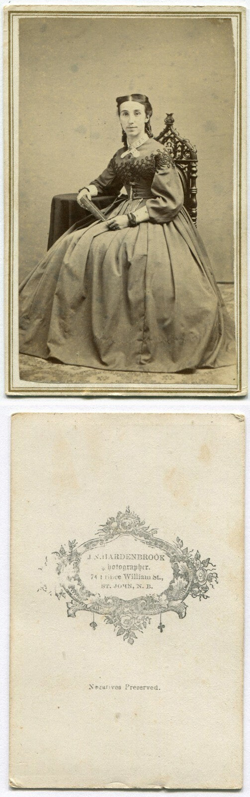 LONG FACED, FLAT HEADED WOMAN, HOLDING BOOK. CDV. ST. JOHN, NEW BRUNSWICK, CAN.