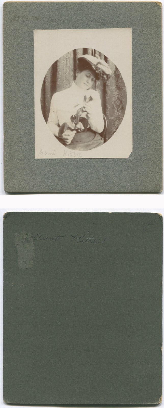 WOMAN IN HAT ADMIRING TULIP. 1890-1900. 6X5 IN.