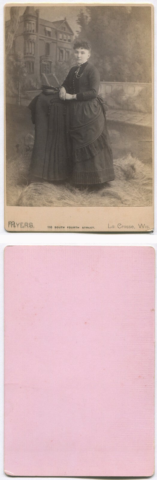 WOMAN POSED W/COAT AND HANDBAG. HOUSE IS PAINTED BACKGROUND. CABINET CARD. WIS.