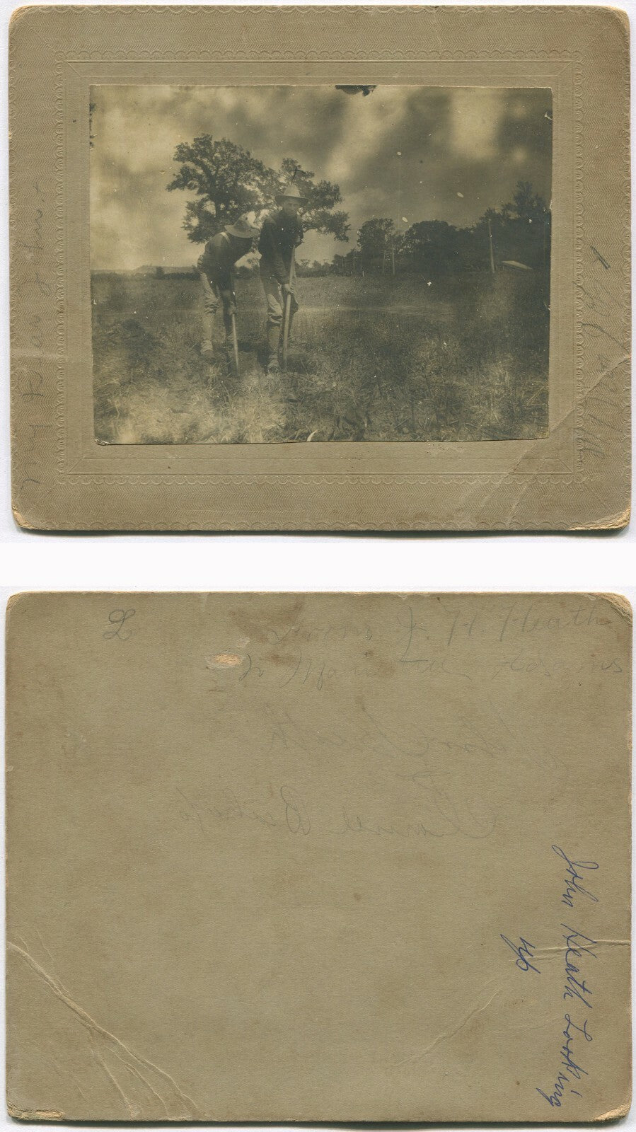 TWO MEN IN U.S. MILITARY UNIFORM DIGGING IN A FIELD. 3.75X4.75 TONED B&W.
