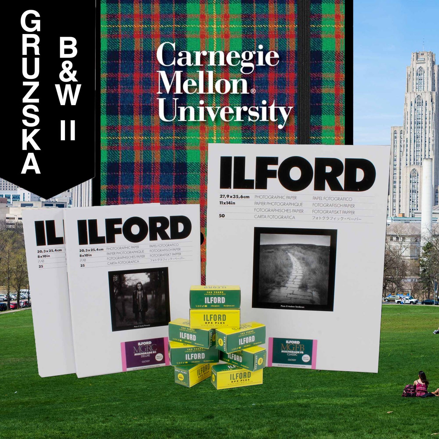 Ilford photographic paper and film boxes with Carnegie Mellon University and Gruzska branding on a grassy field.