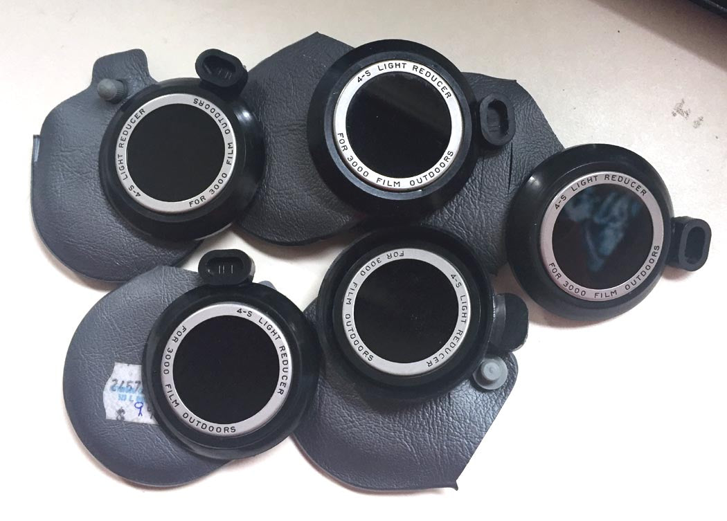POLAROID 4-S LIGHT REDUCER FILTER IN ORIG.CASE, SET OF 5