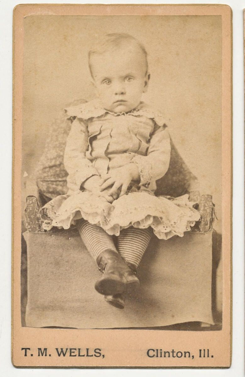 CDV Card Photo From The 1800s of Pouty Toddler Girl Wearing Striped Stockings