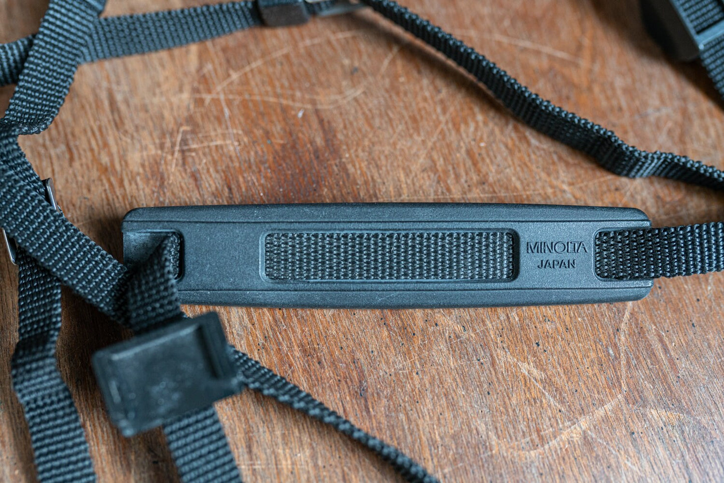 Vintage Black Minolta Camera Strap w/ Shoulder Pad, Cap Keeper