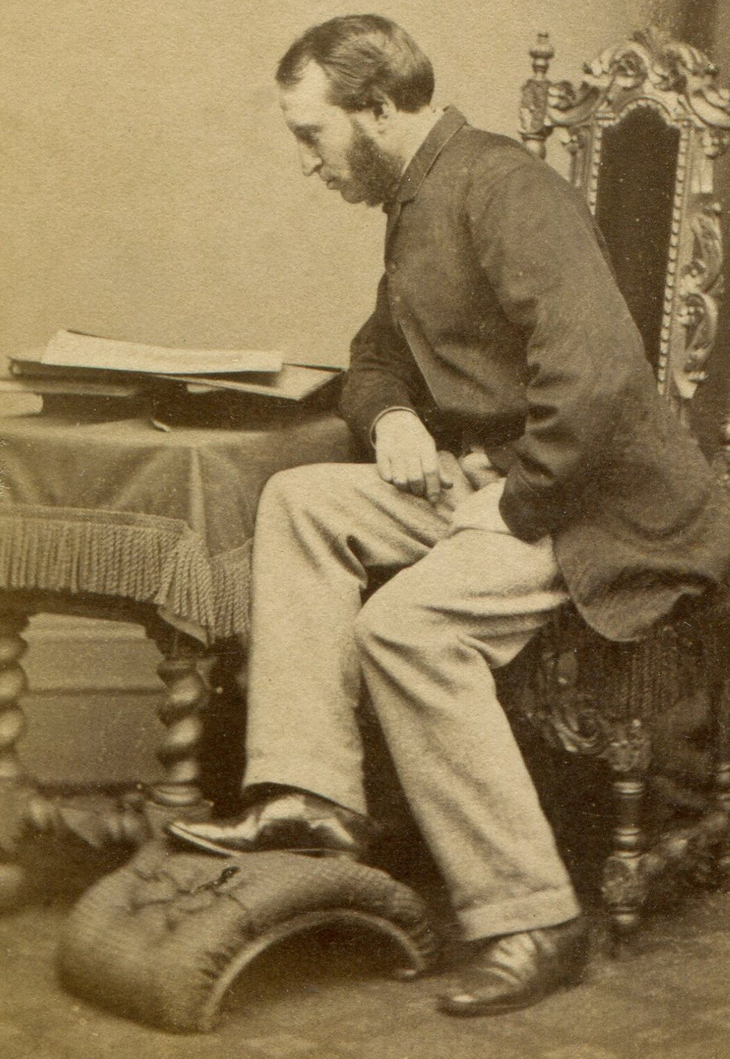 ENGLISH ARISTOCRACY, MAN POSED AT TABLE READING. CDV. MANCHESTER, ENGLAND.