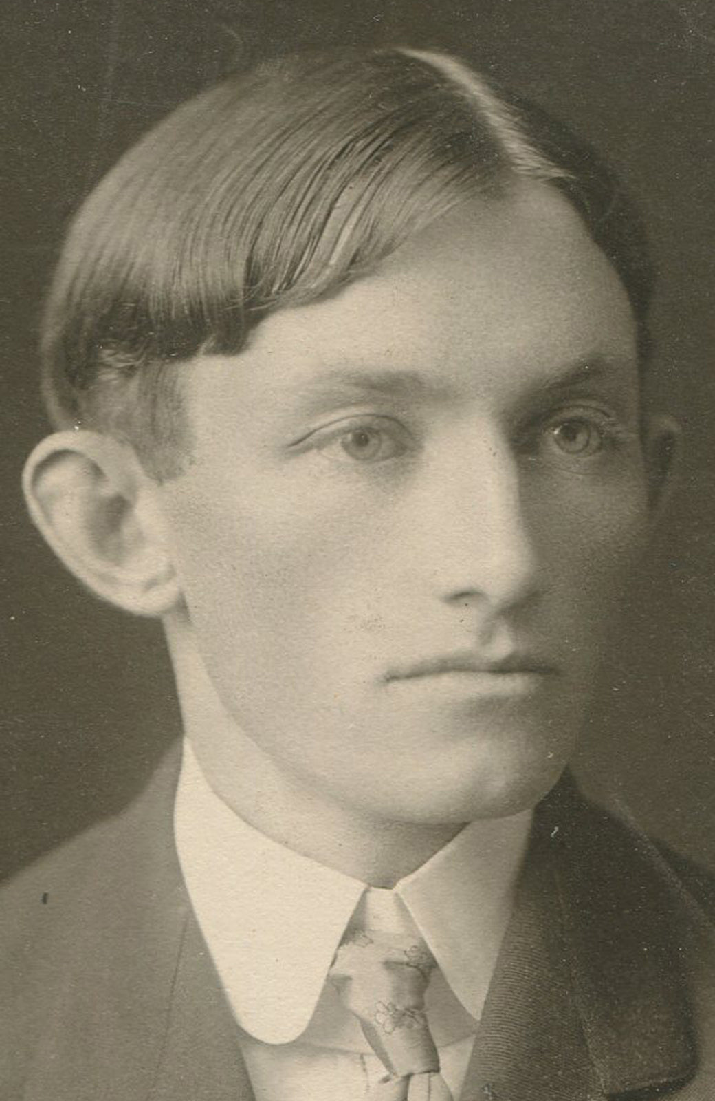 ODDLY HANDSOME YOUNG MAN WITH WONDERFULLY LARGE EARS. SILVER PRINT CIRCA 1900.