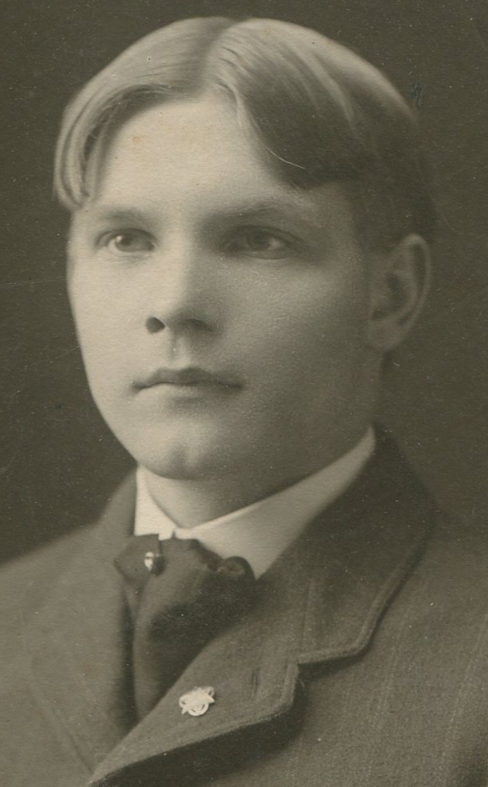 CLEFT CHINNED YOUNG MAN WITH VERY STRAIT HAIR. SILVER PRINT CIRCA 1900.