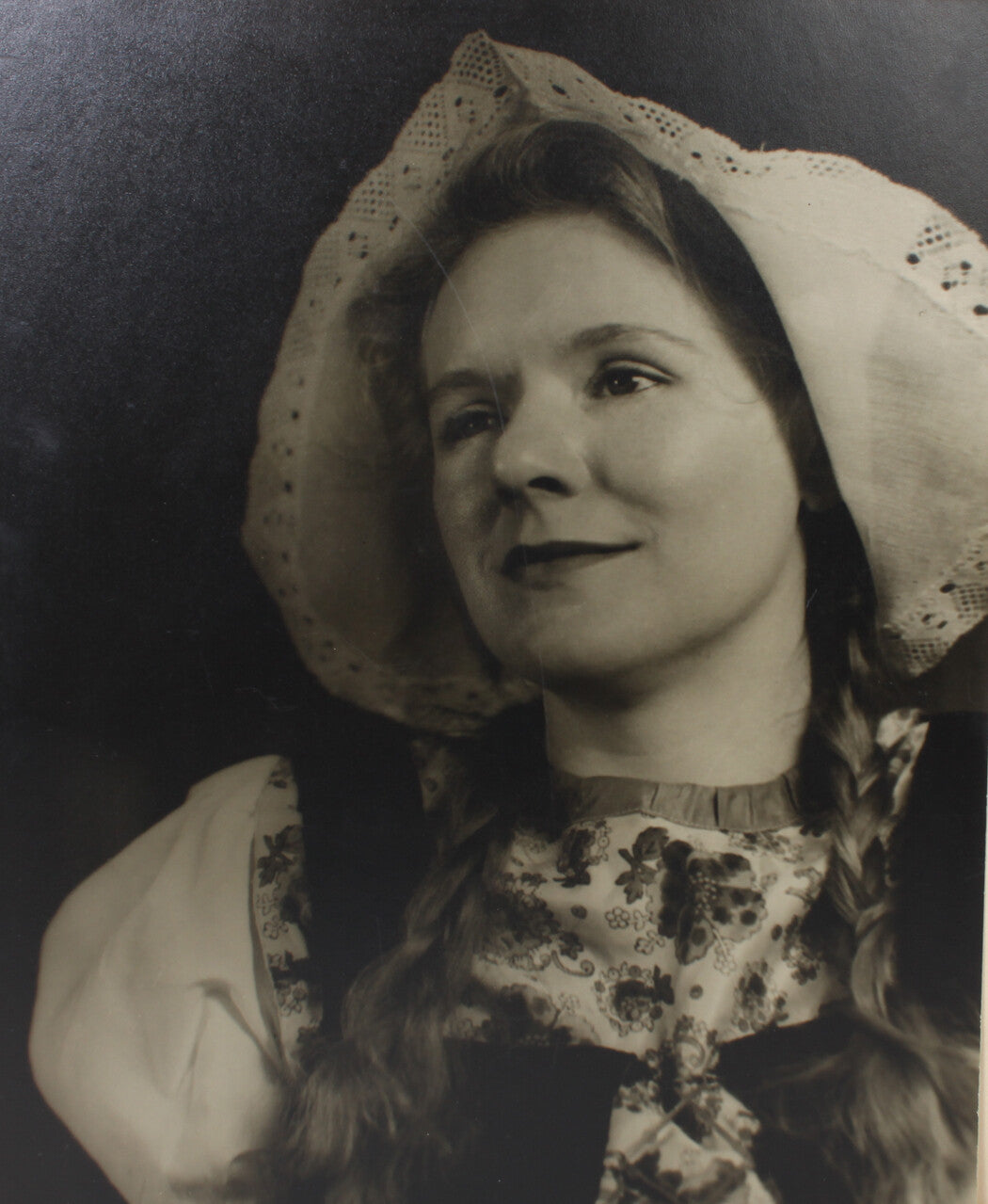 YOUNG WOMAN IN TRADITIONAL DUTCH ATTIRE. 17 X 14 INCH SILVER PRINT.
